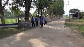 Thai pupils recycle old bikes to make wall around school field
