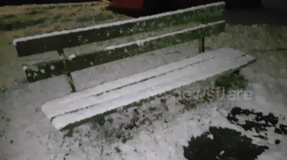 Snow comes down and starts to settle on the hills in Buckinghamshire