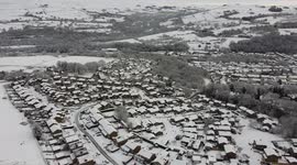 Watch this stunning aerial shot over snow-covered towns and peaks as a drone captures winter over Whaley Bridge