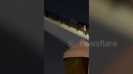 Man dangles from rising drawbridge in Miami