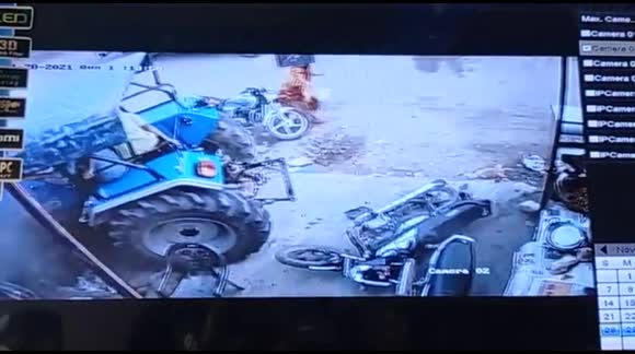 Pedestrians escape by inches as they jump out of way of high-speed tractor driven by children in India