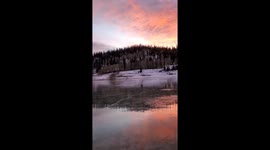 Iceskater glides across picturesque mountain valley in Utah