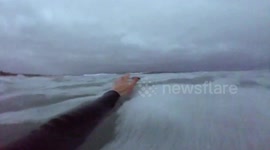 Heart-warming moment seal gets up close and personal for CUDDLE with surfer