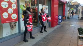 Dancing charity workers bring joy to London's Walthamstow Market with Christmas song
