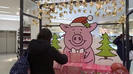 Londoners enjoy Christmas shopping with Percy Pig at Marks and Spencer Oxford Street