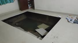New home's floor collapses in India as floodwaters wash away earth below