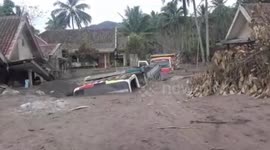Vehicles buried in volcanic ash after Mount Semeru eruption