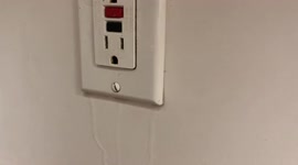 Water flowing from an electrical outlet because of the floods in Hawaii, USA