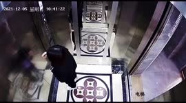 Chinese woman bangs on wrong elevator doors trying to operate lift