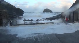 Storm Barra hits Trebarwith Strand , Gull rock drenched in  Froth 2