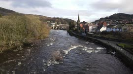 Aerial footage: Beautiful winter sun over a deserted town of Llangollen, North Wales during a Covid lockdown