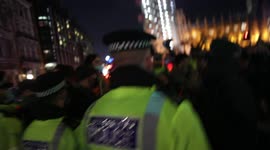 Kill the Bill protestors drum while fenced in by MET police