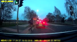 Man doesn’t look, avoids being hit by a car by one step and rolls away