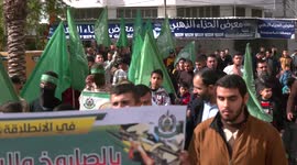 Hamas supporters march through Gaza on groups 34th anniversary