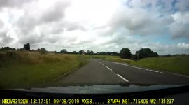 Car travelling the wrong way around a roundabout