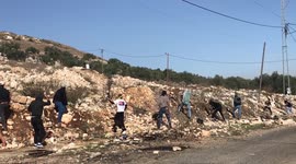 Palestinian protesters clash with Israeli security forces in the village of Kfar Qaddum