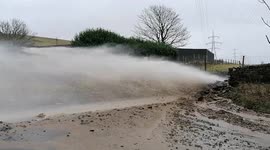 A river has burst through the ground on Old Blackstone Edge throwing out stones and a deluge of water