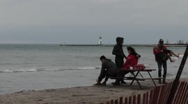Warm December day in Ontario, Canada sends people to the beach as mercury hits 19 degrees
