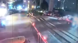 Impatient motorcyclist hit by speeding train after slipping through level crossing barrier