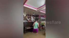Music lover plays his beloved piano for the last time as super typhoon Rai smashes into the Philippines