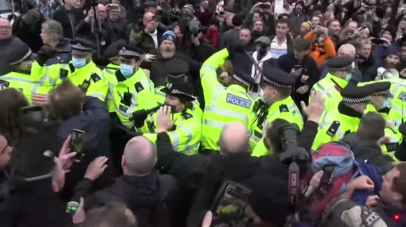 Protesters shout 'We stand together' at police during COVID march in London