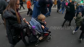 Young toddler at anti-vaxx passport protest leads crows with a whistle  18/12/20 London