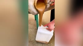 Incredibly satisfying footage shows woman pouring sauce into pot without spilling a drop