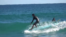 Florida surfers hit the waves just days before Christmas