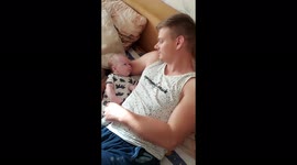 Newborn toddler learns to talk to his dad