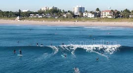 Surfers Catch Waves on a Crisp December Day in Drone Video Shot in Delray Beach, Florida