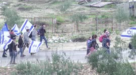 Thousands of Israeli settlers demonstrate calling on the government not to demolish a yeshiva at an illegal settlement outpost, in the northern West Bank.