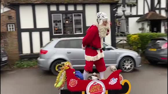 Santa CRUISE: Father Christmas delivers presents on electric sleigh in Surrey village