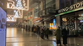 Shoppers queue around the block as Next opens for its Boxing day sale