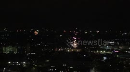 Manchester's Skyline Lights Up As The Clock Strikes Midnight. Ending 2021