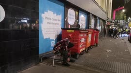 Man Drunk By Bins On New Years Day