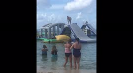 Blob Fail - Fat guy failing on the blob inflatable lake toy.
