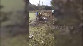 Locals unite to rescue cow stuck in sewage water in central India