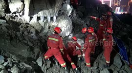 Firefighters dig out trapped people after landslide hits construction site in China