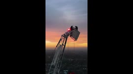 Moment daredevils climb 558ft crane WITHOUT harness just to watch London sunrise