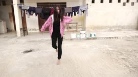 Palestinian artist Dima Karaz 19, performs a contemporary dance on the roof of her house