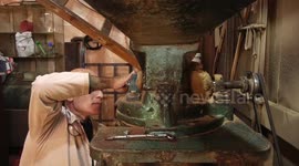 Palestinian Jihad Abdo, 52, grinds spices in an old mill at his shop in a popular market