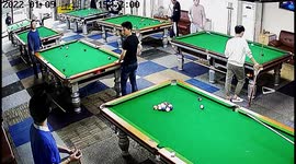 Pool players shocked as man on another table knocks down two of their balls
