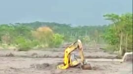 Heavy-duty vehicles caught in cold lava flow streaming down Indonesia's Mount Semeru