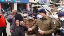 Central Indian police gift roses, chocolates and masks to commuters flouting Covid-19 norms