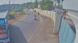 Indian scooter rider has TWO near-misses with bus and tree