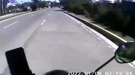 Kind biker rescues kitten stuck on a busy road in the Philippines