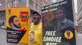 Bail application for man accused of torching South African parliament as supporters protest outside court