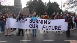 A group of young environment activists stop traffic in Bristol, UK