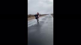 Ouch! Biker pulls a wheelie that's a bit too high and pays the price
