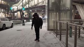 Winter storm hits New York City: falling snow coats sidewalks in Lower Manhattan